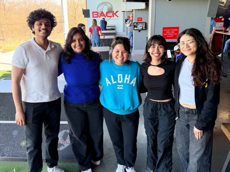Terri Wada with four Collabo XD team members, arm in arm at a team outing.